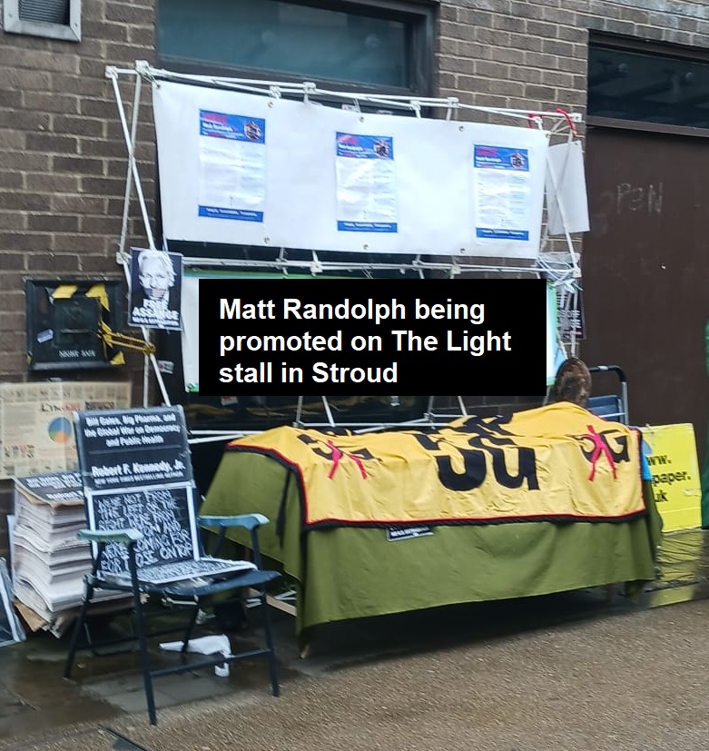 Stall distributing The Light in Stroud promoting Matt Randolph's posters on its banner